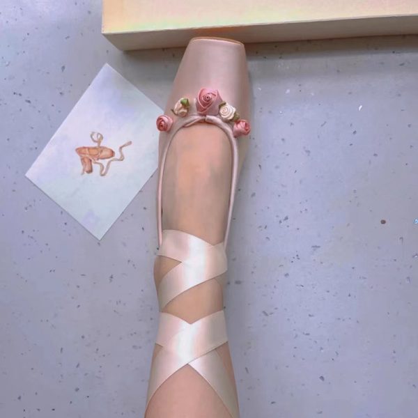Woman Wearing Ballet Slippers With Cross Lacing - Image 2